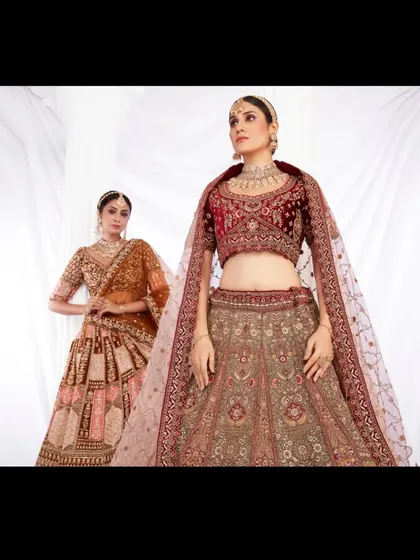 Two stunning bridal looks in one frame. This image features a classic maroon velvet lehenga alongside a contemporary rust-orange piece, showing the variety in my collection.
