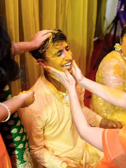 More hands, more haldi. This photo captures the communal and celebratory nature of the Haldi ceremony perfectly.
