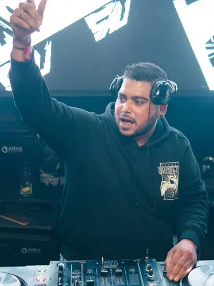 Pointing to the sky as the energy peaks. This is me signaling that we're taking the party to the next level.