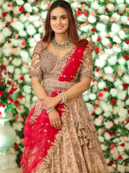 A happy and radiant client, ready for her reception. The soft makeup and romantic hairstyle create a look that is both beautiful and timeless.