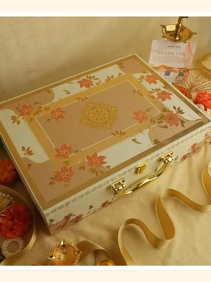 This "White Bliss" hamper is presented in a beautiful floral suitcase box, a perfect gift for Navratri or Diwali that exudes elegance and purity.