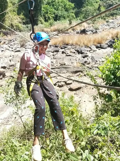 A participant enjoys the ride on a rope activity at our Barapole summer camp.