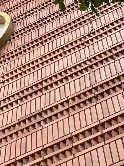 Close-up shots of the patterned brick facade. This level of detail is a hallmark of our work, showcasing the skill of our masons and our commitment to creating tactile, handcrafted building surfaces.
