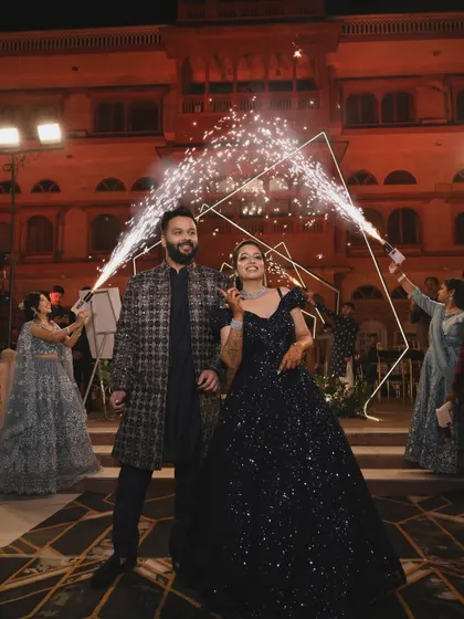 A sparkling entry for a glamorous couple. I used cold pyro fountains to frame their entrance, making them shine against the backdrop of a royal palace setting for their sangeet night.
