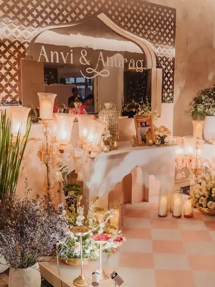 This welcome corner set the tone for modern royalty. We used a custom mirror with the couple's names, traditional candelabras, and lush florals to transport guests into a bygone era of romance.