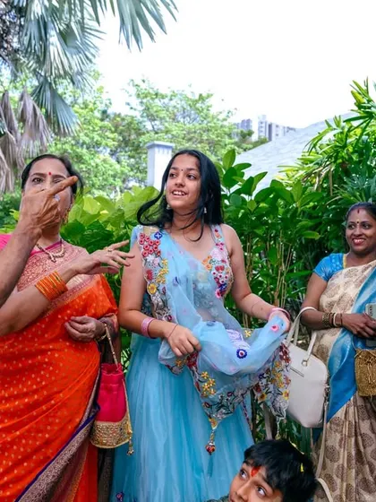 A moment of interaction and blessing during a thread ceremony. I focus on capturing the important rituals and the emotions that accompany them.