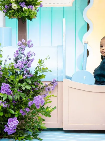 The birthday boy, Aadhvik, enjoying a ride in his very own pastel-colored train car. I design my props to be both beautiful and fun for the little ones.