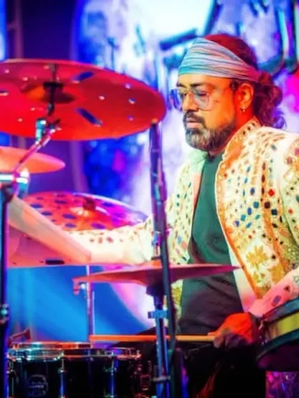 Our drummer, in his element, with a beautifully designed jacket that matches the stage's flair.