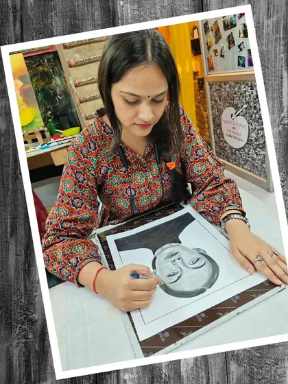 A student working on a pencil portrait. We emphasize a strong foundation in drawing as the basis for all other art forms.