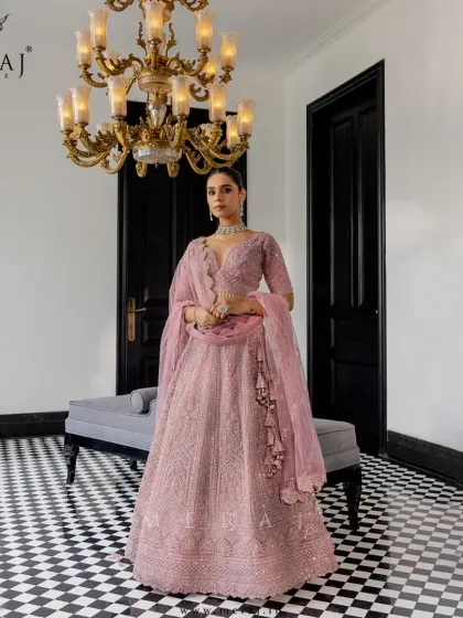 A full view of the blush lehenga, showcasing its regal and romantic design, perfect for the modern bride with a royal heart.