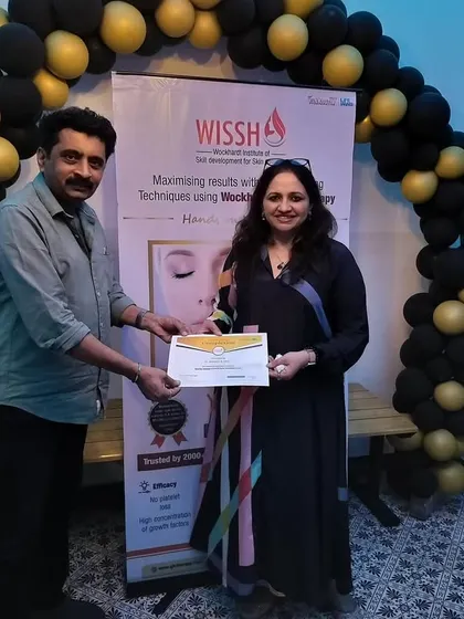 Presenting a certificate of completion to a doctor at my GFC Therapy workshop. It's a privilege to train other medical professionals in advanced aesthetic procedures.