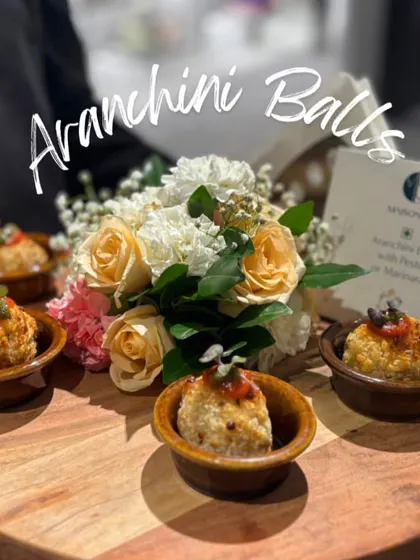 Golden-fried Arancini Balls, a staple of my Italian-inspired menu. These risotto balls are filled with cheese and served with a choice of pesto or marinara sauce.