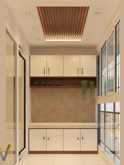 This balcony design features a comfortable bay seat with plenty of storage underneath. An upper cabinet unit includes a small display shelf for plants, turning a compact balcony into a cozy and functional space for relaxation.