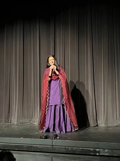The stage is a space where I can act as the 'sootradhar', the thread-holder, weaving stories together to connect with the hearts of the audience. Here, I was hosting and narrating a theatrical show, a role that reminds me of the importance of every part in creating a beautiful whole.