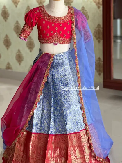The full lehenga set on a child-sized mannequin, showing the complete, adorable look.