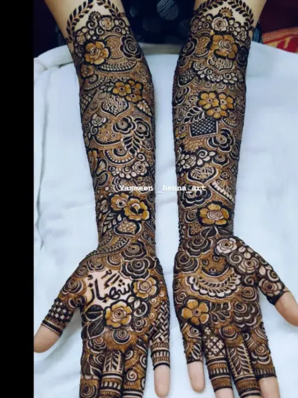 A darker, more contrasted photo of Hiba's bridal mehndi, showing the incredible detail in the design.