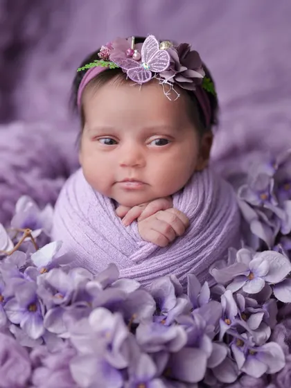 An adorable awake moment in a purple floral setting. I love capturing their curious expressions as they take in the world around them.