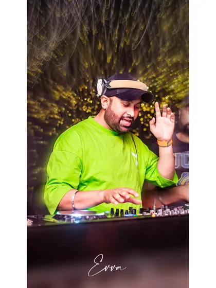 Waving to the crowd while keeping the beats flowing. Interacting with the audience is a huge part of my performance style, making everyone feel like part of the show.