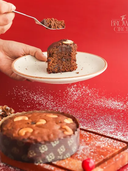 A slice of our classic Christmas Plum Cake. It's dense, moist, and full of flavour from the soaked fruits and warm spices.