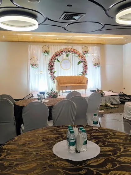A view from the guest tables towards the engagement stage.