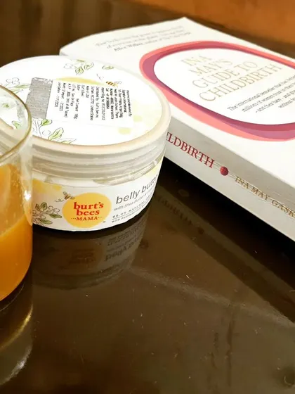 My three companions during week 38 of pregnancy. Hot drinks like red raspberry leaf tea, a good belly moisturizer to keep my skin hydrated, and the book "Ina May's Guide to Childbirth" to keep my mind prepped with positive birth stories.