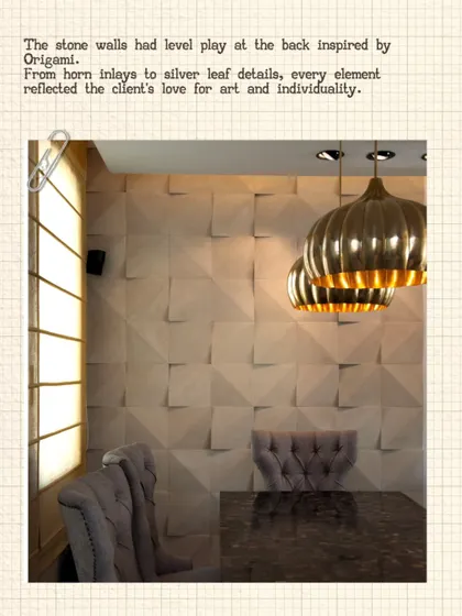The dining area of the Modi Residence features stone walls with a level play inspired by origami. This textural detail, combined with metallic pendant lights, reflects the client's love for art and individuality.