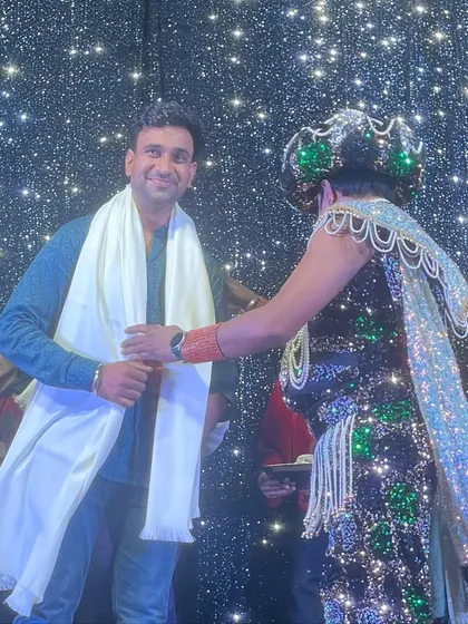 Receiving a shawl from Magician Ajooba ji on stage. This gesture of respect from a senior artist means the world to me.