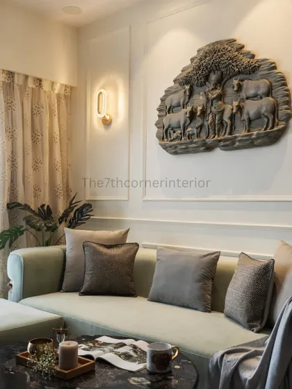 The magnificent Krishna artwork, set within a classic wall moulding panel, serves as a spiritual and artistic focal point in this living space. Wall washer lights create a soft ambiance, enhancing the intricate details.