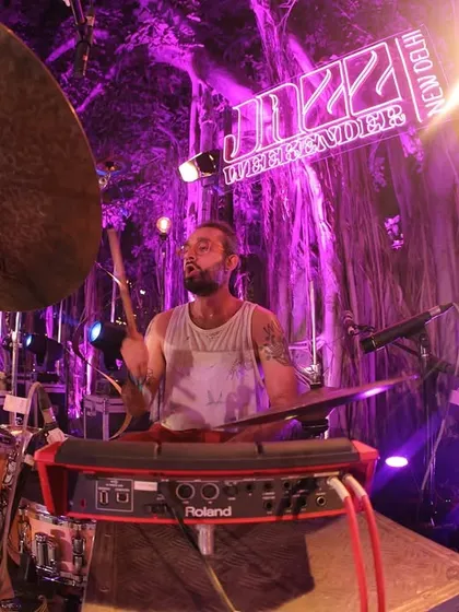 A close-up, fish-eye view of a drummer in full flow at the Jazz Weekender. We ensure high-quality production to support the incredible musicianship on display.