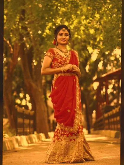 A full view of a stunning reception lehenga look. The makeup is kept classic and radiant to balance the heavily embroidered outfit, creating a regal and elegant appearance.