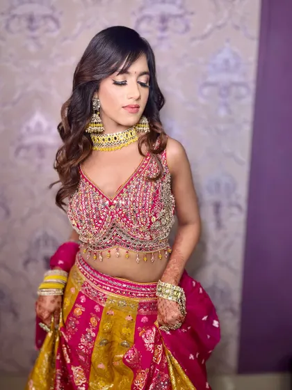 A playful pose showing off the beautiful lehenga and the subtle, elegant makeup.