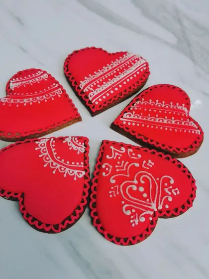 A small collection of my red and white heart cookies. The designs are all slightly different, which makes each cookie feel unique. These make for a really thoughtful and delicious gift.