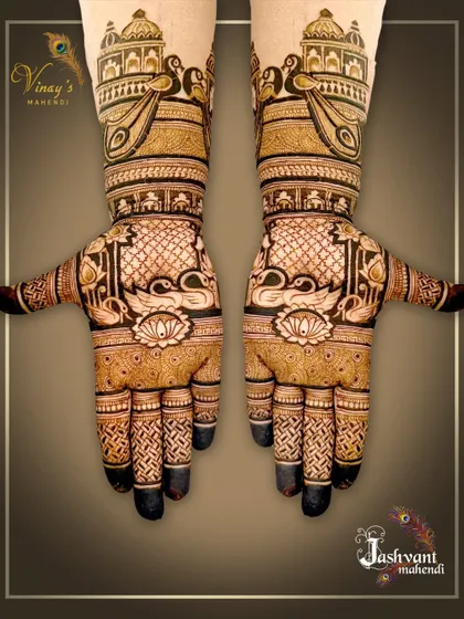 A beautiful designer mehndi with swans on the palms and palace architecture on the arms. The fingertips are left dark for a classic look.