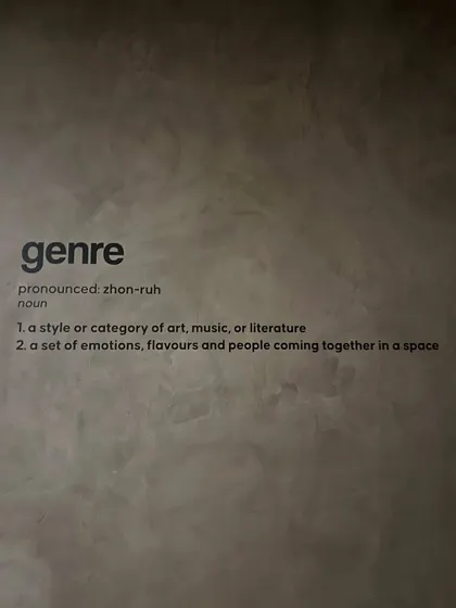 The definition of 'genre' on the wall says it all. It's about a set of emotions, flavors, and people coming together in a space, which is what I strive for.