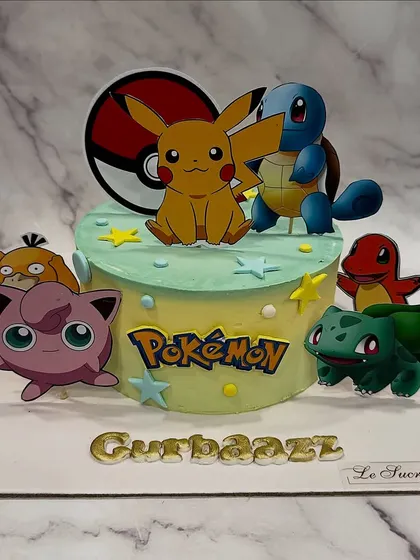 Gotta catch 'em all! This Pokémon-themed cake brings the world of Pikachu, Squirtle, and Bulbasaur to the party, complete with a Poké Ball and personalized name.