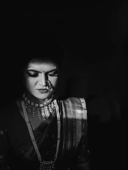 A slightly different take on the dramatic light portrait. This black and white photo of Kinjal has a quiet, introspective feel, highlighting the beautiful details of her bridal jewelry.