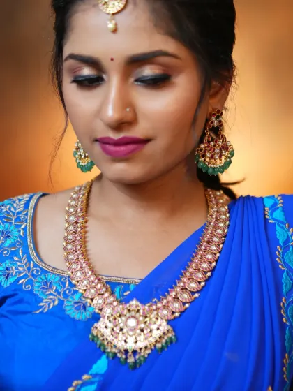 A beautiful, soft-focus shot highlighting the elegance of the Jadau necklace.