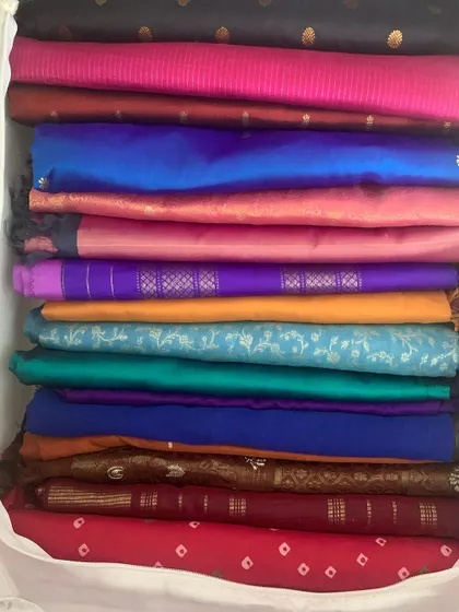 I love the vibrant colors in my saree collection. Seeing them all stacked and organized like this brings me so much joy and makes getting dressed a creative process.