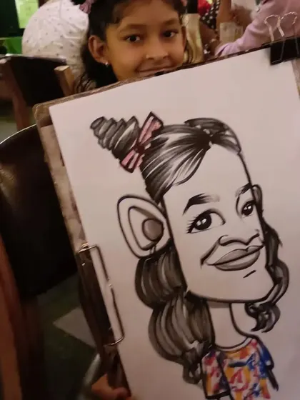 A young girl with her fun caricature.