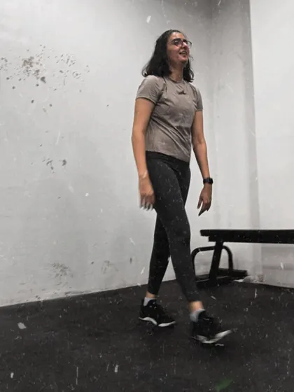A candid moment of a member walking through the gym after a workout. The look of satisfaction and exhaustion is a familiar sight here.
