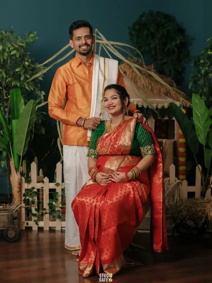 A beautiful portrait of a couple celebrating their pregnancy with a South Indian traditional theme.