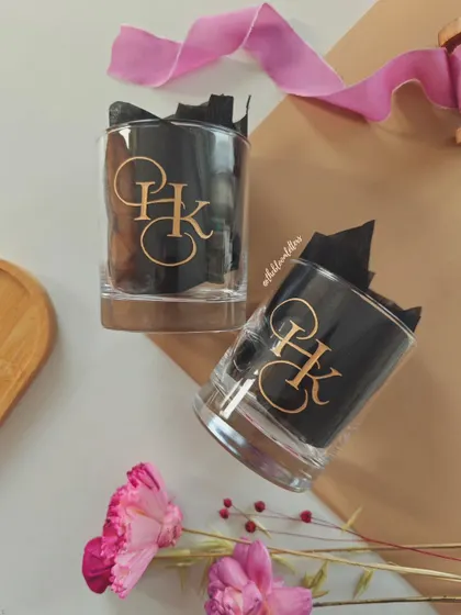 An elegant monogram for a special couple. These hand engraved whiskey glasses feature a custom 'HK' design, making them a sophisticated and personal gift for a wedding or housewarming.
