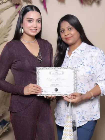 Presenting a certificate to another talented graduate. I provide lifetime support to all my students.