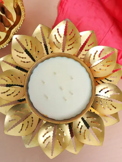 A top-down view of our stunning multi-wick lotus urli, a true showstopper for any festive occasion.