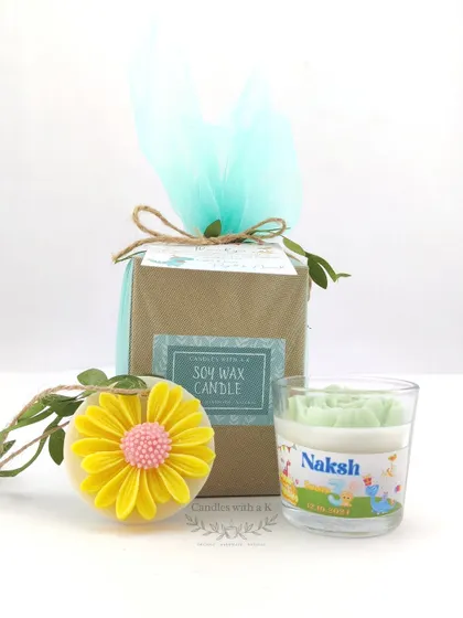 A birthday return gift box for a dinosaur-themed party. The set includes a peony votive candle and a daisy wax sachet, showing how I can mix and match products to fit a client's needs.