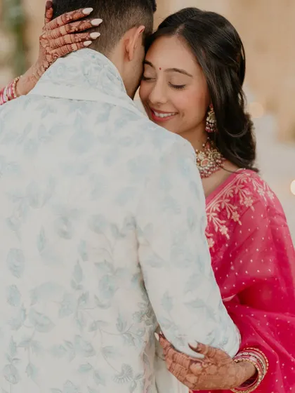 A quiet embrace between Kajal and Ram. This photo focuses on their connection, capturing a moment of peace and love amidst the excitement of their wedding events.