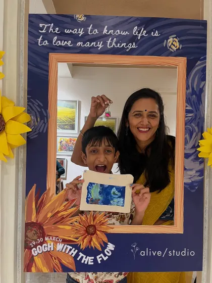 A mother and son showing off their creation at our 'Gogh with the Flow' event. The excitement on his face says it all.
