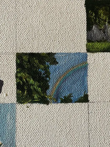 A mini-painting of a rainbow peeking through the trees.