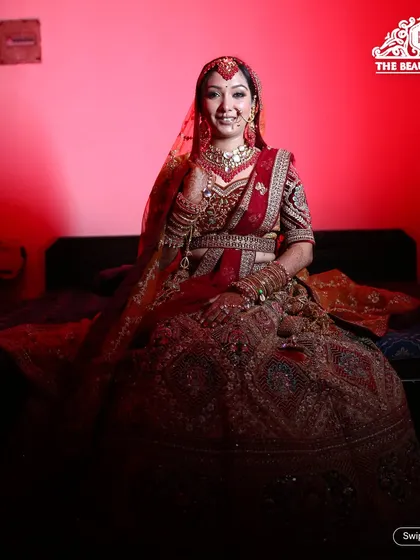 A smiling bride ready for her big day. The makeup is classic and elegant, designed to make her feel confident and beautiful.
