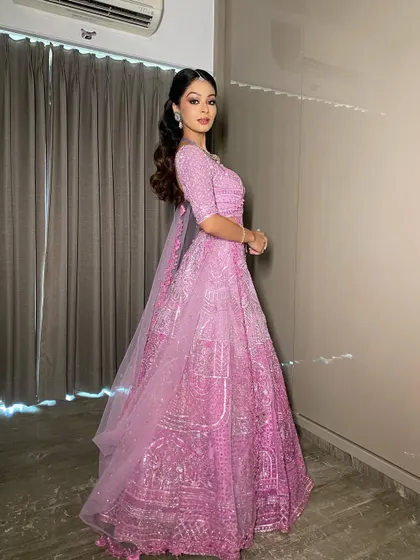 The magic of minimal grandeur in this stunning pink lehenga. I created a sharp, winged liner and a glossy lip for a look that is edgy, classy, and perfect for a new-age bride.